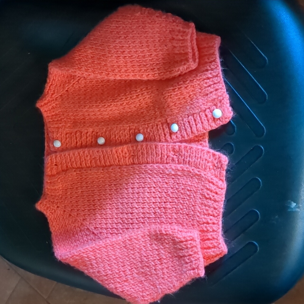 This is a homemade knitted sweater size 12 to 18 months gently used